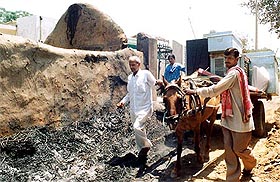 People leave with their belongings for a safer place