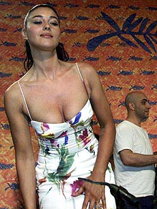 Italian actress Monica Belluci poses for photographers