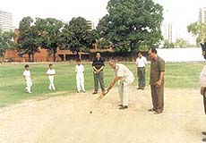 Maj-Gen Virender Singh plays the first ball before the start of the 26th Lala Raghubir Singh Memorial Cricket Tournament at the Modern School ground in the Capital.