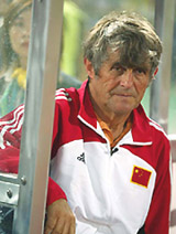 China's coach Bora MilutInovic watches during the first half of the warm-up match against Portugal in Macau.