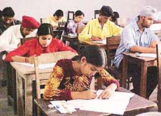 Candidates take the joint entrance test in Ludhiana on Sunday.