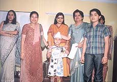 A tiny winner with the guests at the Chitrakaar 2002 event.