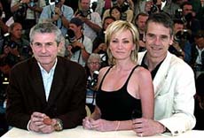 French director Claude Lelouch (left) poses for photographers with French actress Patricia Kaas and British actor Jeremy Irons during a photocall for his film "And Now Ladies and Gentlemen" in Cannes on Sunday.