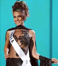 Miss India Neha Dhupia poses during the preliminary evening gown competition of the Miss Universe 2002 presentation show in San Juan, Puerto Rico, on Friday.