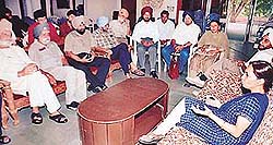Ms Geetika Kalha, Secretary, Cultural and Tourism, Punjab, interacts with city-based artistes at the Punjab Kala Bhavan in Chandigarh on Monday.