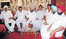 Mr Lal Singh, Finance, Planning and Food and Supplies Minister, flanked by Mr Rakesh Pandey, Mr Gurcharan Singh Ghalib and party legislators at the meeting with Congress councillors in Ludhiana on Monday. 