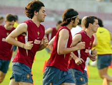 Portugal's soccer player Hugo Viana Marco Caneira and Armando Petit run during a training session