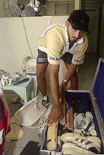Harbhajan Singh packs gear in the dressing room at Sabina Park where the second one-day international match against the West Indies was cancelled due to poor weather in Kingston, Jamaica, on Sunday. 