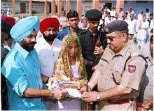 All-India Anti-Terrorist Front Chairman M.S. Bitta distributes food