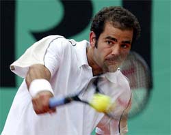 Pete Sampras of the USA returns a shot 