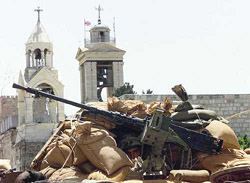 Israeli soldier's take up positions outside the Church of Nativity