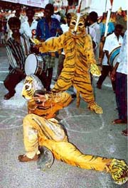 A folk is being performed by two DMK supporters