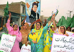 Workers of Nawaz Sharif�s Muslim League Party celebrate missile tests in Multan on Tuesday.