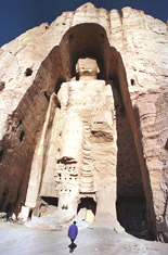 A visitor walks past the 55-metre-high Buddha statue