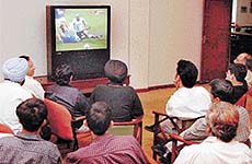 Soccer lovers glued to television at the PCA stadium in SAS Nagar on Friday. 