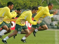 Brazil's Ronaldo, Luizao, Emerson and Junior train with rubber strips