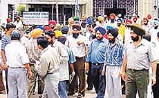 Residents raise slogans in protest against the alleged rape of a girl by certain employees inside a religious place in Ludhiana on Saturday.