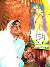 Ms Basheeran Bee, who lost her husband during the communal violence in Gujarat recently,  with her son Iliyas