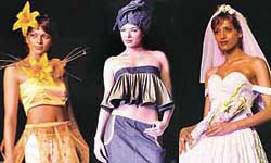 Models display outfits designed by NIIFT students, at a fashion show