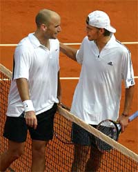 Andre Agassi of the USA is congratulated by Paul-Henri