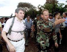 Visiting US Deputy Defence Secretary Paul Wolfowitz walks with a US military officer at the Philippine Army's remote Tabiawan camp 