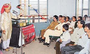 A magician speaks on AIDS awareness at Government Primary School in Burail village, Sector 45, Chandigarh, on Tuesday.�