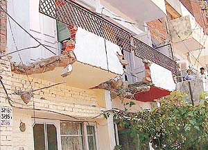 Municipal Corporation staff demolishes an illegal structure in Sector 41, Chandigarh