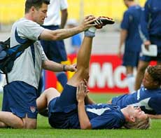 US forward Clint Mathis has hit leg stretched by a trainer