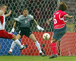 South Korea's Yoo Sang-Chui scores his team's second goal