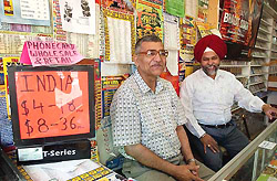 Tabish Muhammad Yusef of Pakistan and Amarjit Singh of India work together at Sona Music House in New York on Monday.