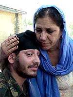 A soldier seeks blessings from his mother