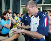 French soccer star Zinedine Zidane signs autographs
