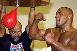 Co-trainer Stacy McKinley watches Mike Tyson 