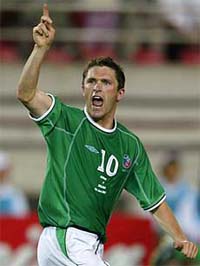 Robbie Keane celebrates after scoring against Germany