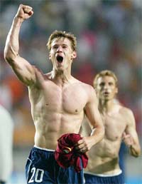 Brian McBride celebrates after the USA defeated Portugal