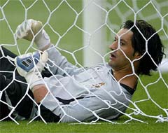 Portugal's goalkeeper Vitor Baia lies in the net