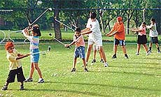 Youngsters try the swing 