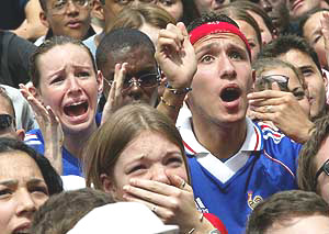 French soccer team supporters react in Paris