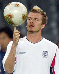 England's captain David Beckham spins a ball