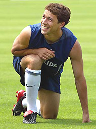 US player Steve Cherundolo laughs as he stretches during the team's practice