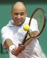 Andre Agassi of the USA returns a backhand during his quarter-final match against Juan Carlos Ferrero of Spain at the French Open at the Roland Garros Stadium on Thursday.