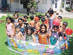 Tiny tots of Hollyhock Nursery School enjoy