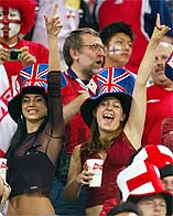 Two England soccer fans cheer for their team