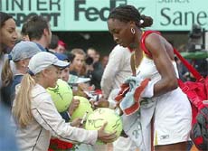 USA's Venus Williams signs autographs to fans