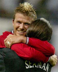 England captain David Beckham hugs goalkeeper David Seaman