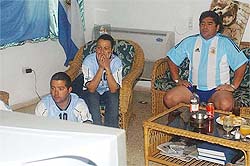 Argentine soccer legend Diego Maradona watches the England-Argentina World Cup match