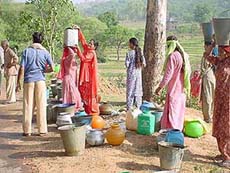 People leave after getting water