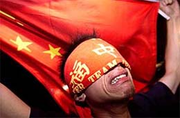 A Chinese football fan cries after China lost to Brazil