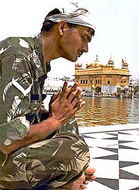 A soldier prays for peace