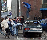 Football fans wreck a car in central Moscow